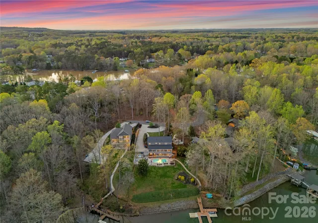 an aerial view of a house with a lake view