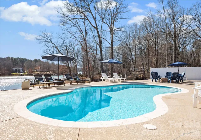 an aerial view of a house with a lake view
