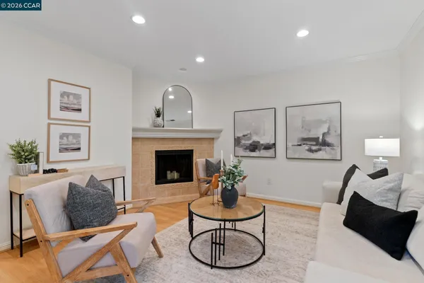 a view of a dining room with furniture and a potted plant