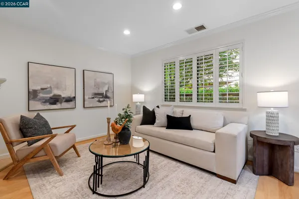 a kitchen with stainless steel appliances a stove a sink a microwave a refrigerator and cabinets