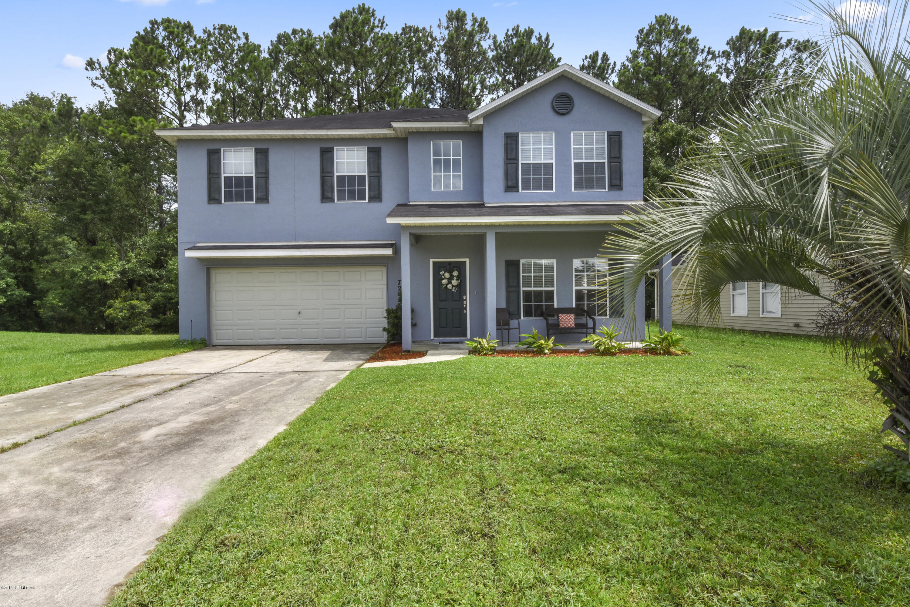 7254 Rampart Ridge Circle South Jacksonville, FL 32244 - Photo 1 of 28 a front view of a house with garden