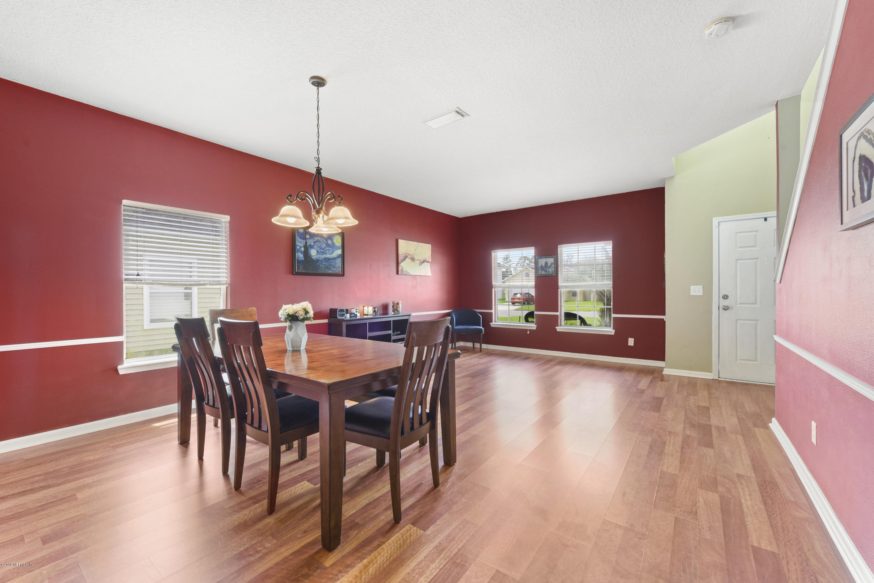 7254 Rampart Ridge Circle South Jacksonville, FL 32244 - Photo 11 of 28 a view of a dining room with furniture window and wooden floor