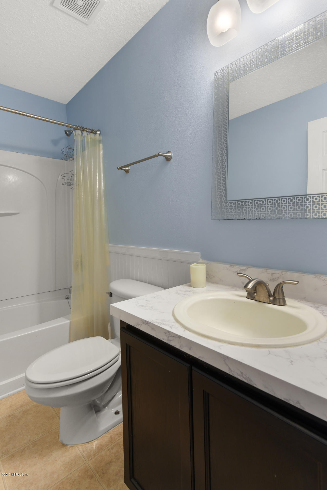 7254 Rampart Ridge Circle South Jacksonville, FL 32244 - Photo 15 of 28 a bathroom with a sink a toilet and shower