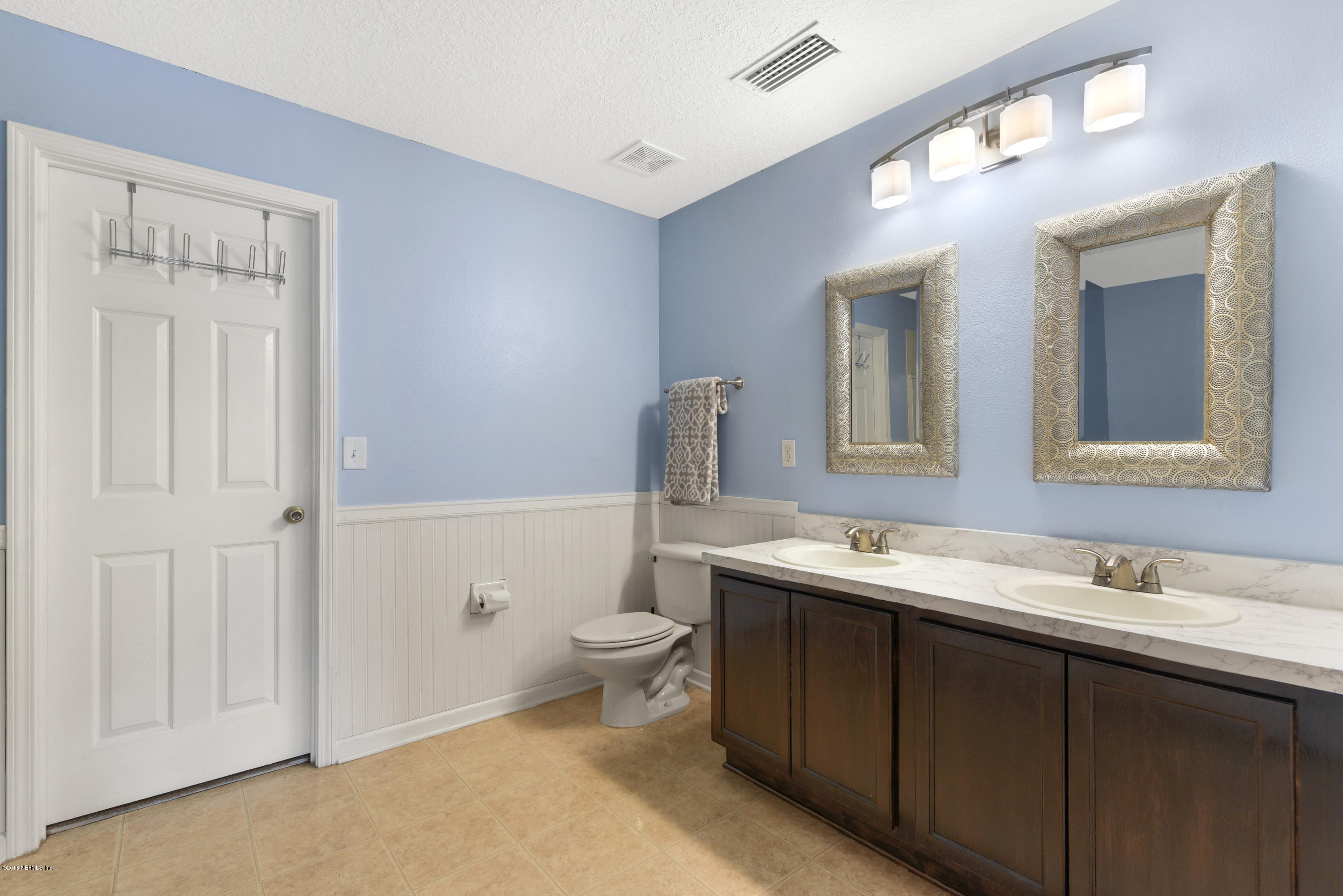 7254 Rampart Ridge Circle South Jacksonville, FL 32244 - Photo 19 of 28 a bathroom with a sink and a toilet