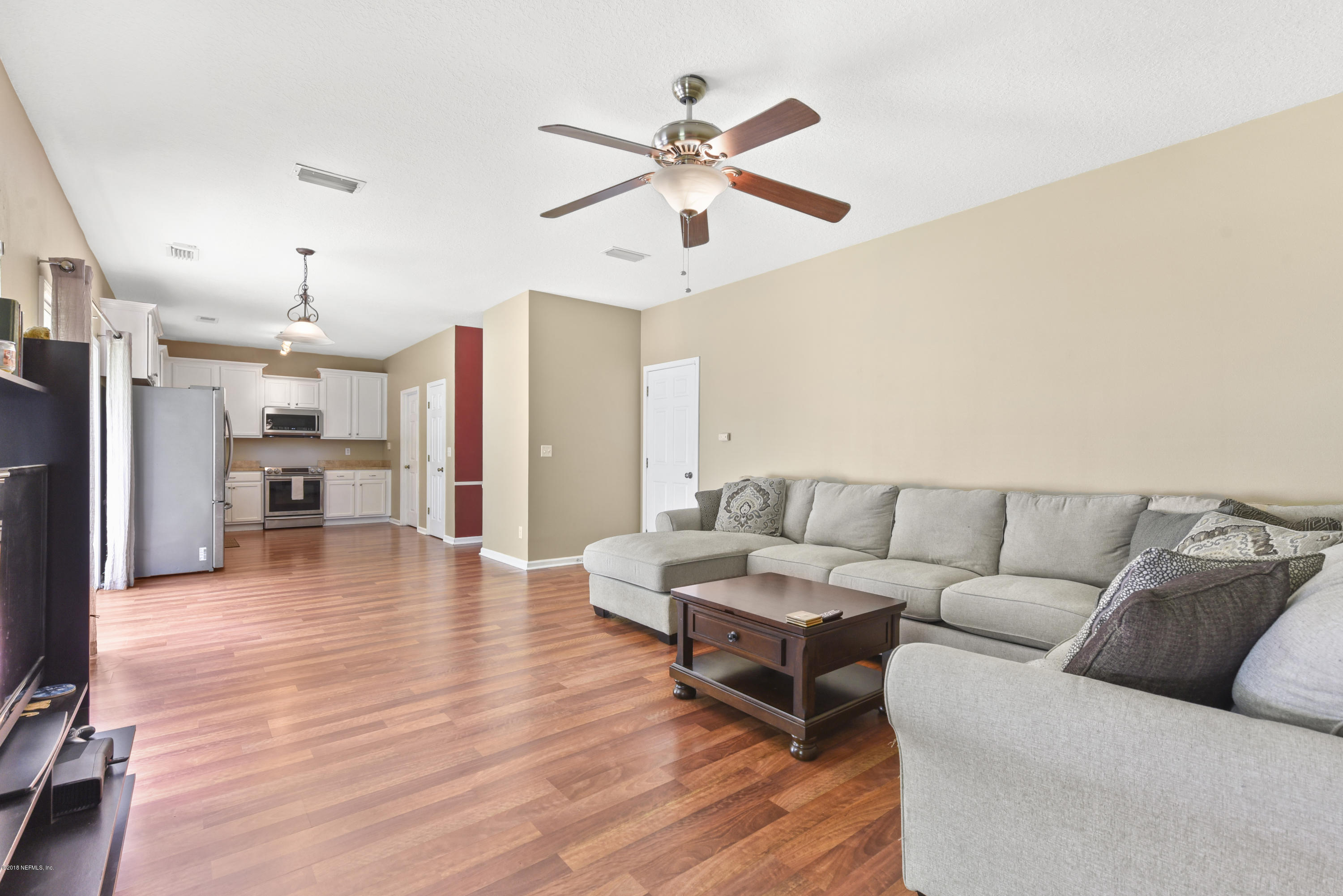 7254 Rampart Ridge Circle South Jacksonville, FL 32244 - Photo 4 of 28 a living room with furniture and kitchen view