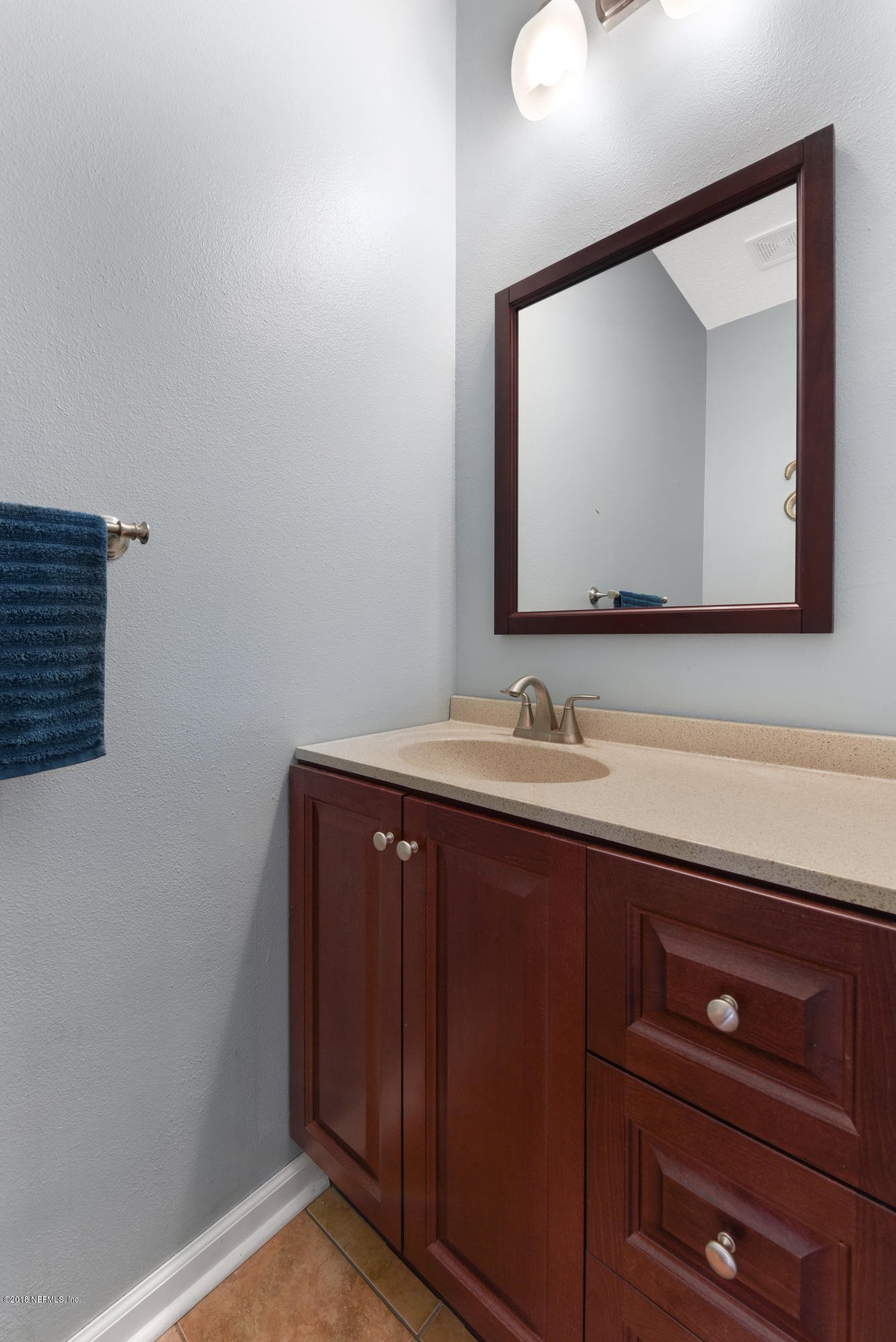 7254 Rampart Ridge Circle South Jacksonville, FL 32244 - Photo 8 of 28 a bathroom with a sink vanity and mirror