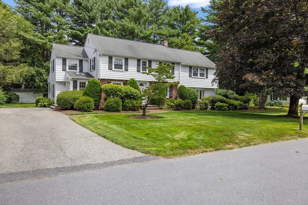 8 Hawthorne Road Lexington, MA 02420 - Photo 1 of 1 a front view of a house with a yard and green space