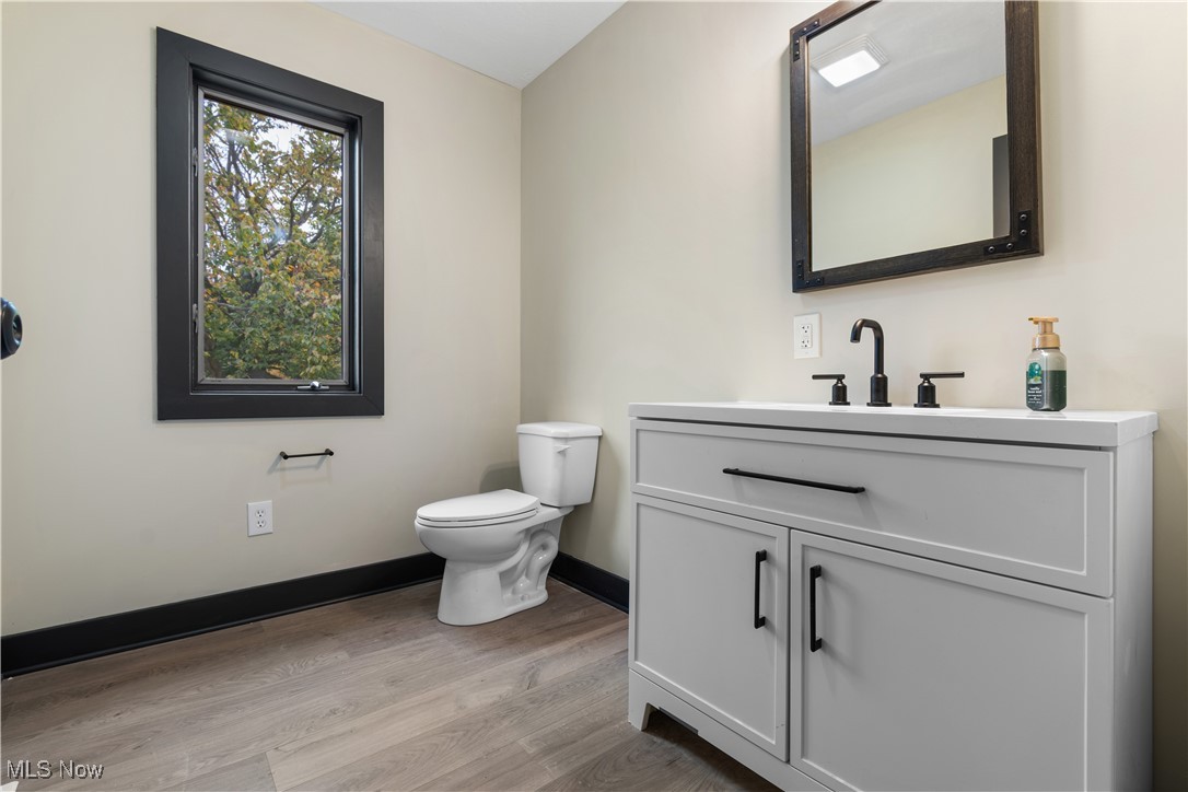 2201 Ridgewood Road Medina, OH 44256 - Photo 25 of 50 Bathroom featuring light wood finished floors and vanity
