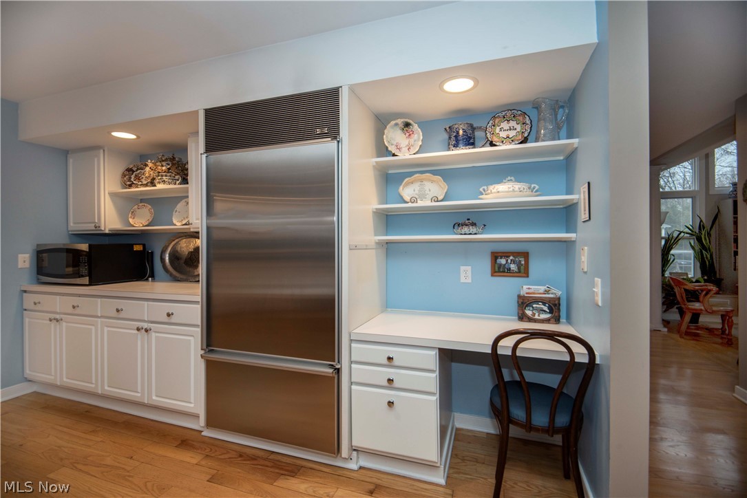 1801 Sheridan Road Cleveland, OH 44121 - Photo 12 of 34 Handy desk with built-in shelves and cabinets surround the Subzero refrigerator.