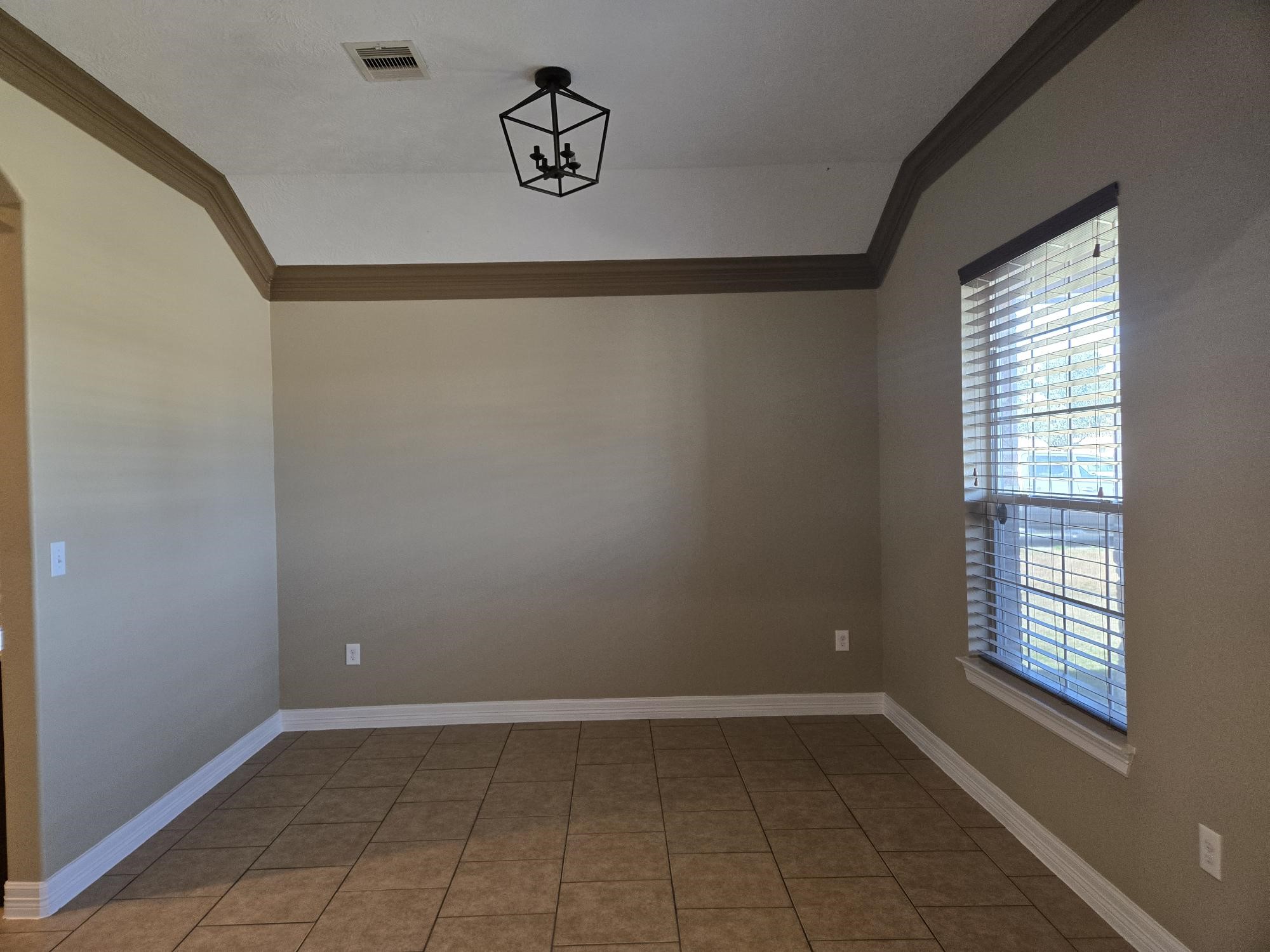 306 Masterson Street Arcola, TX 77583 - Photo 5 of 28 a view of an empty room with a window
