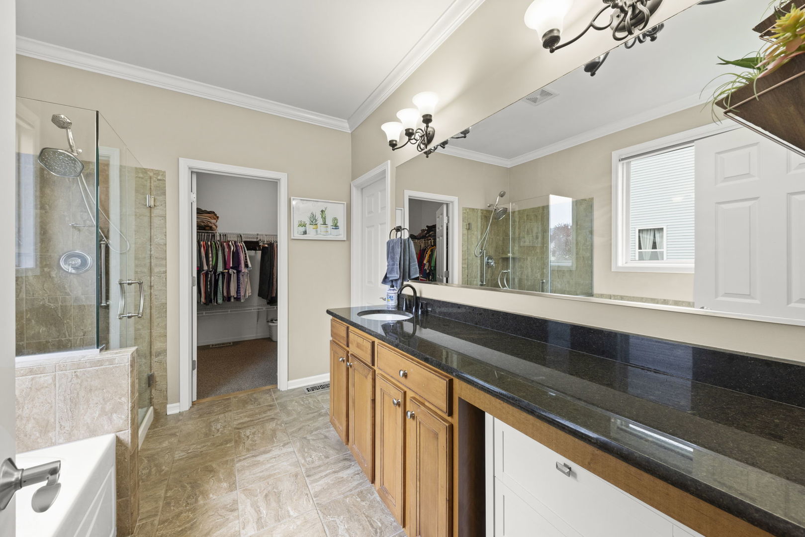 11625 Heritage Meadows Drive Plainfield, IL 60585 - Photo 17 of 40 a large kitchen with granite countertop a sink and dishwasher stove top oven