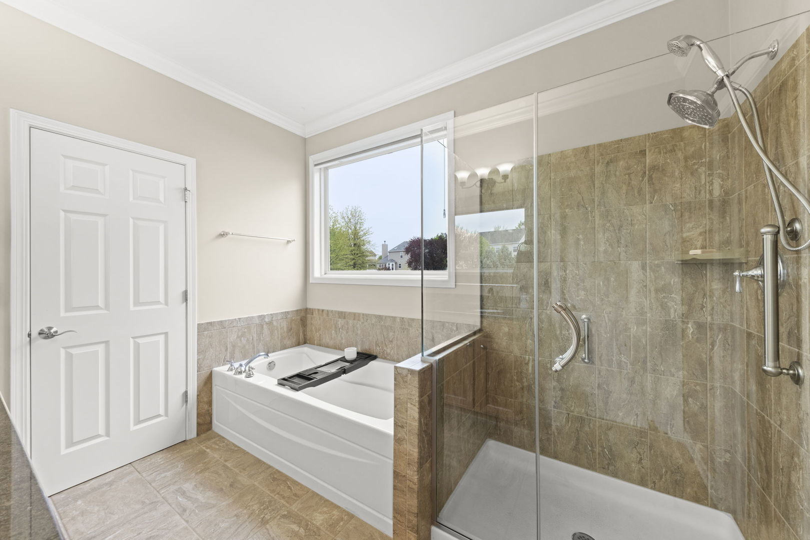 11625 Heritage Meadows Drive Plainfield, IL 60585 - Photo 18 of 40 a bathroom with a sink a mirror and a shower