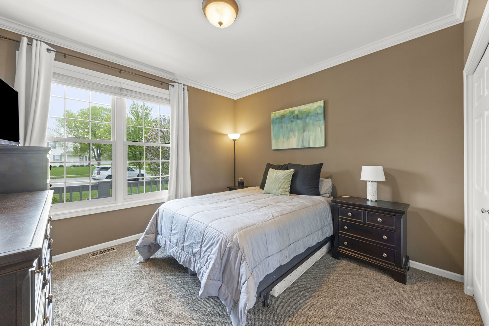 11625 Heritage Meadows Drive Plainfield, IL 60585 - Photo 20 of 40 a bedroom with a bed and a window