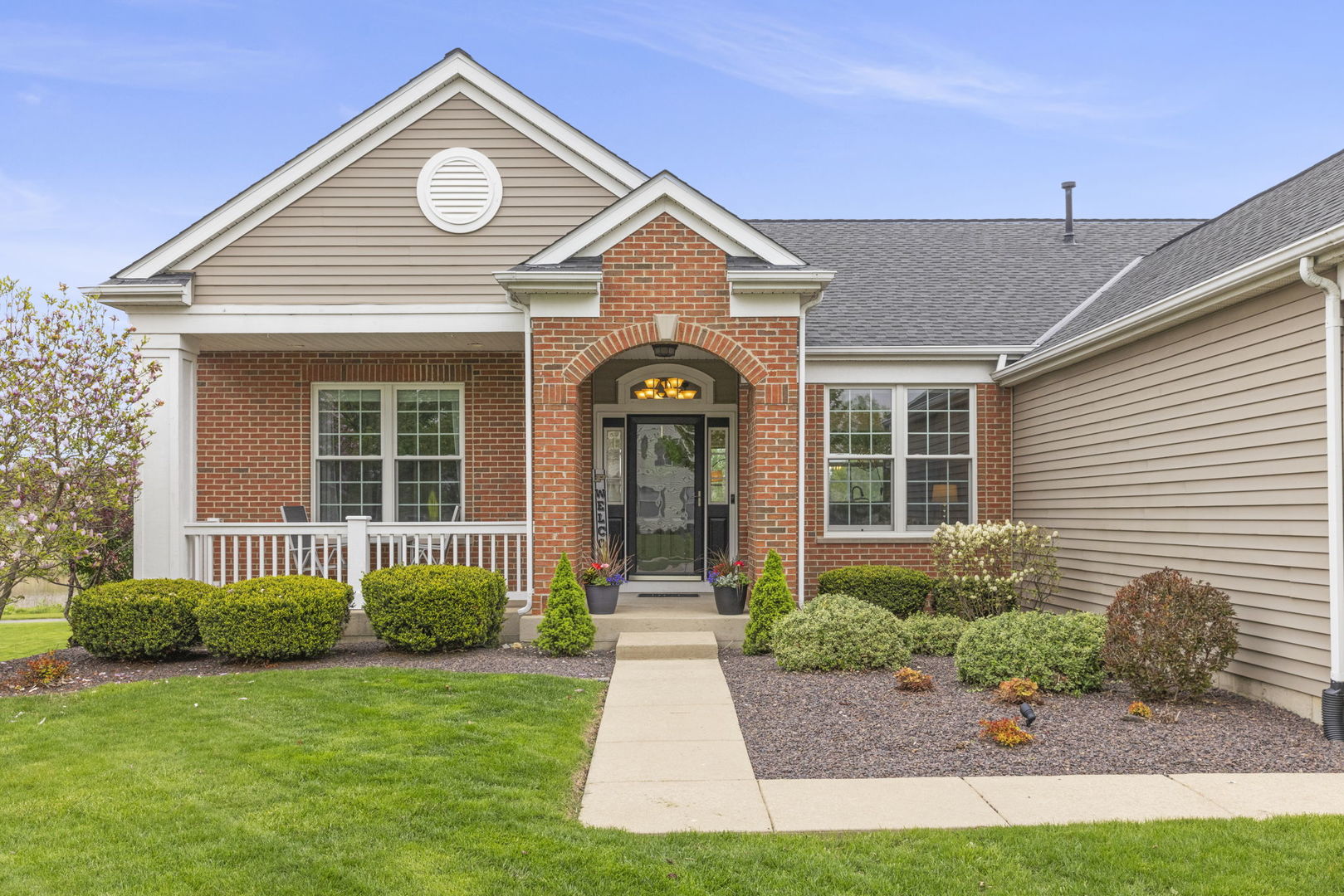 11625 Heritage Meadows Drive Plainfield, IL 60585 - Photo 2 of 40 a front view of a house with garden