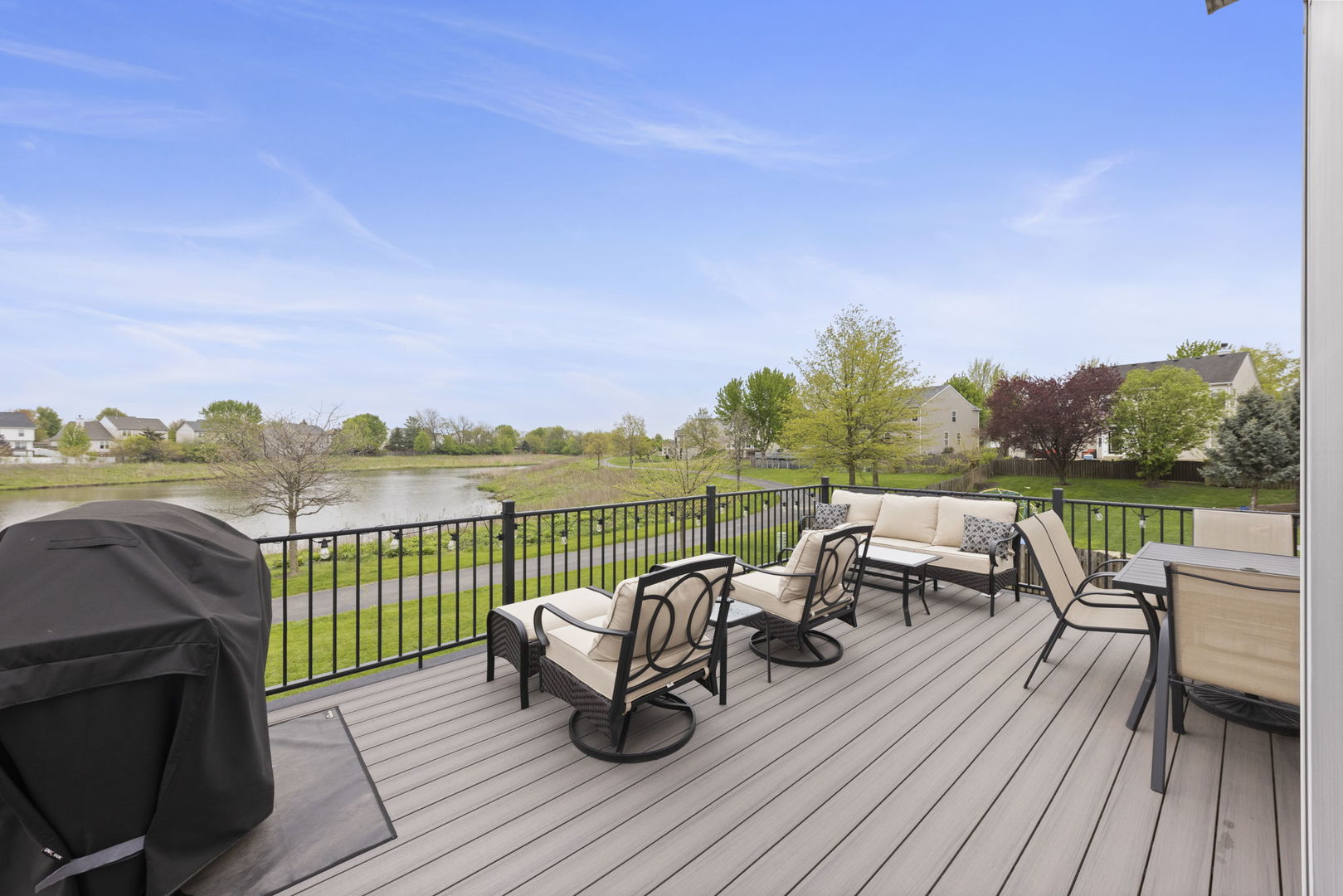 11625 Heritage Meadows Drive Plainfield, IL 60585 - Photo 28 of 40 a view of a roof deck with couches and wooden floor