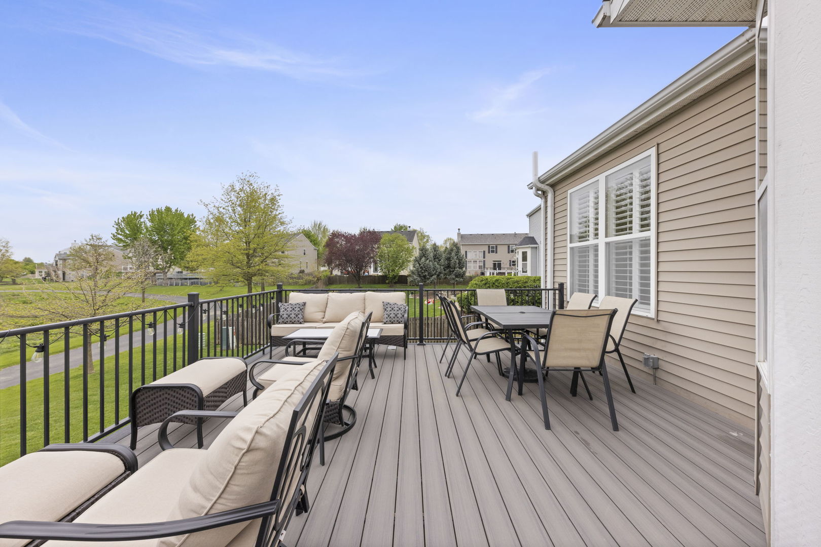 11625 Heritage Meadows Drive Plainfield, IL 60585 - Photo 29 of 40 a roof deck with a table and chairs