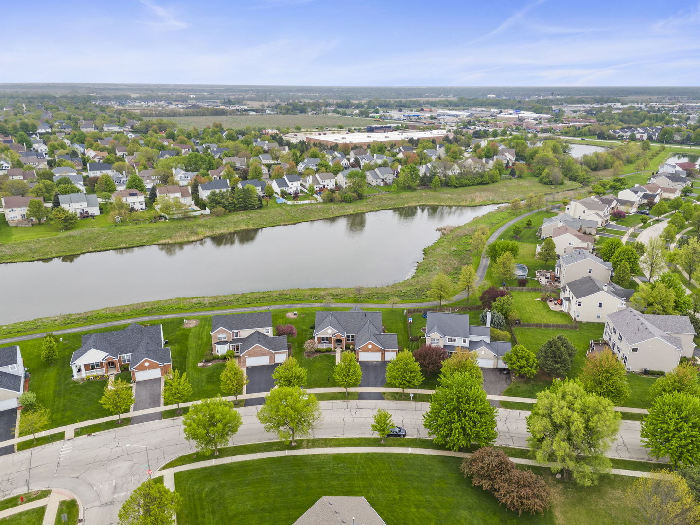 11625 Heritage Meadows Drive Plainfield, IL 60585 - Photo 36 of 40 an aerial view of a city with lots of residential buildings ocean and mountain view in back