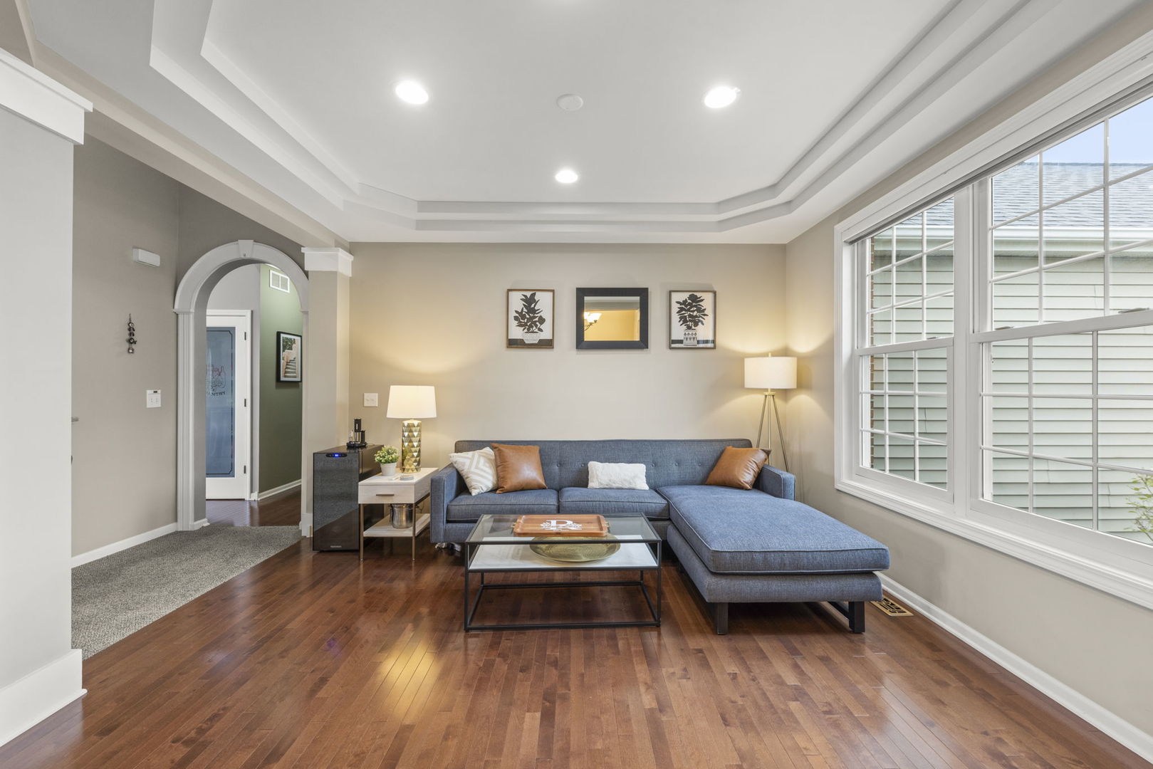 11625 Heritage Meadows Drive Plainfield, IL 60585 - Photo 4 of 40 a living room with furniture and a wooden floor