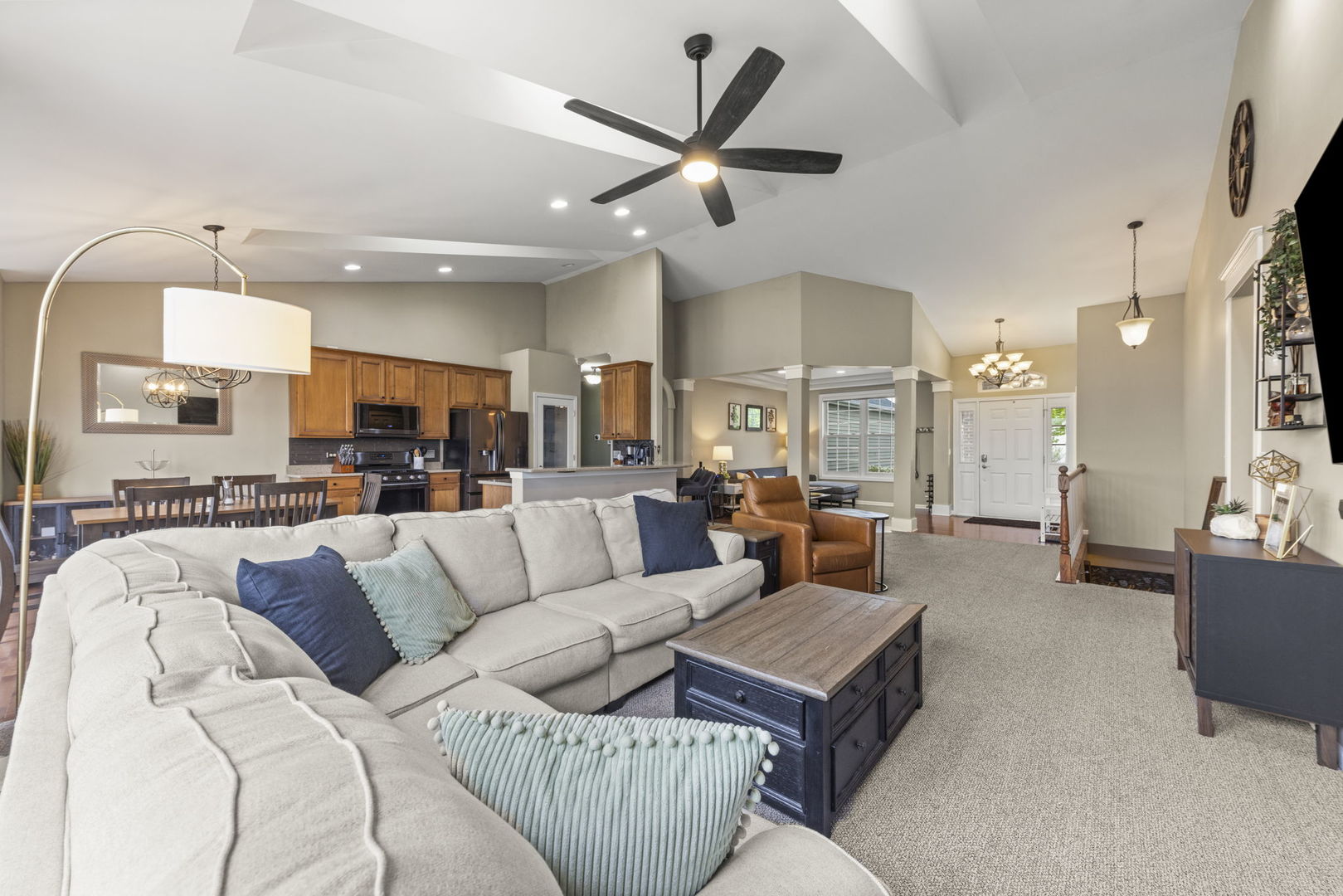 11625 Heritage Meadows Drive Plainfield, IL 60585 - Photo 7 of 40 a living room with furniture kitchen view and a chandelier