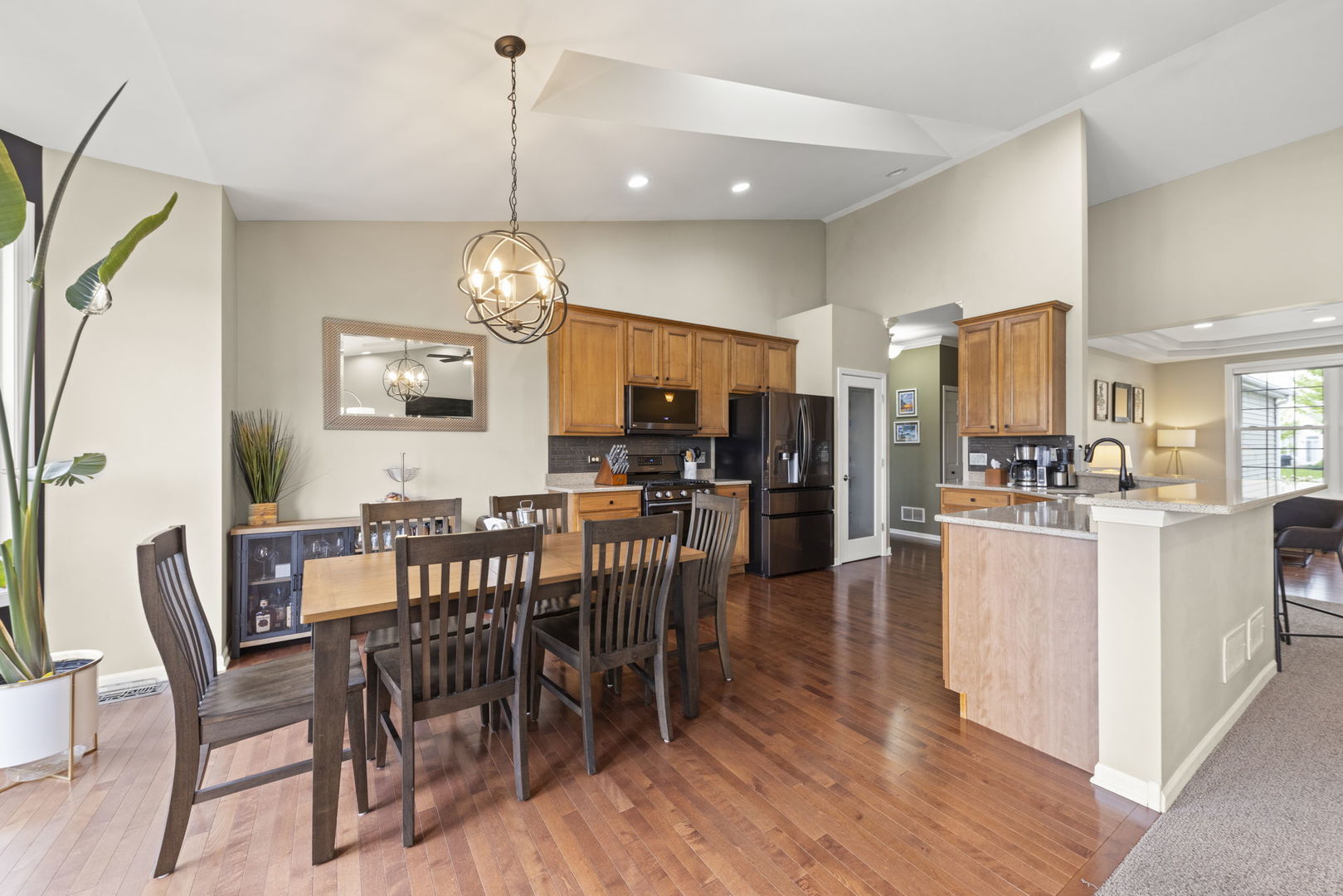 11625 Heritage Meadows Drive Plainfield, IL 60585 - Photo 9 of 40 a view of a dining room with furniture window and wooden floor