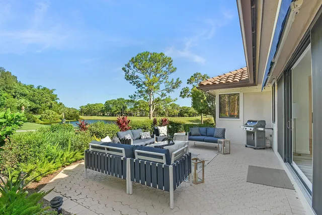a bathroom with a sink a mirror a vanity and a shower