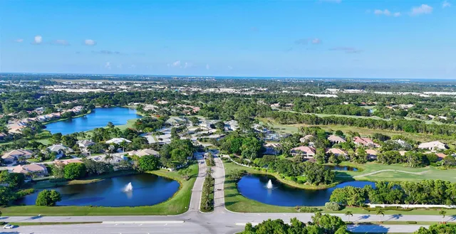 an aerial view of house with yard