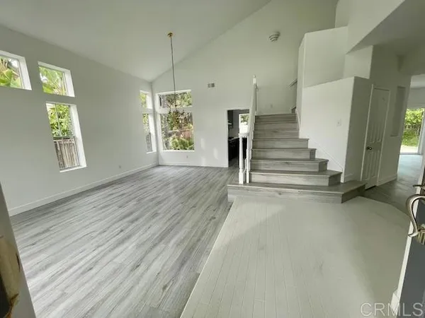 a view of entryway with wooden floor and window