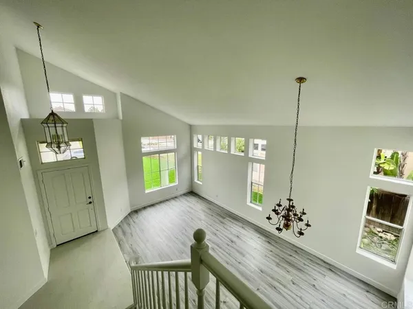 a room with stairs and wooden floor