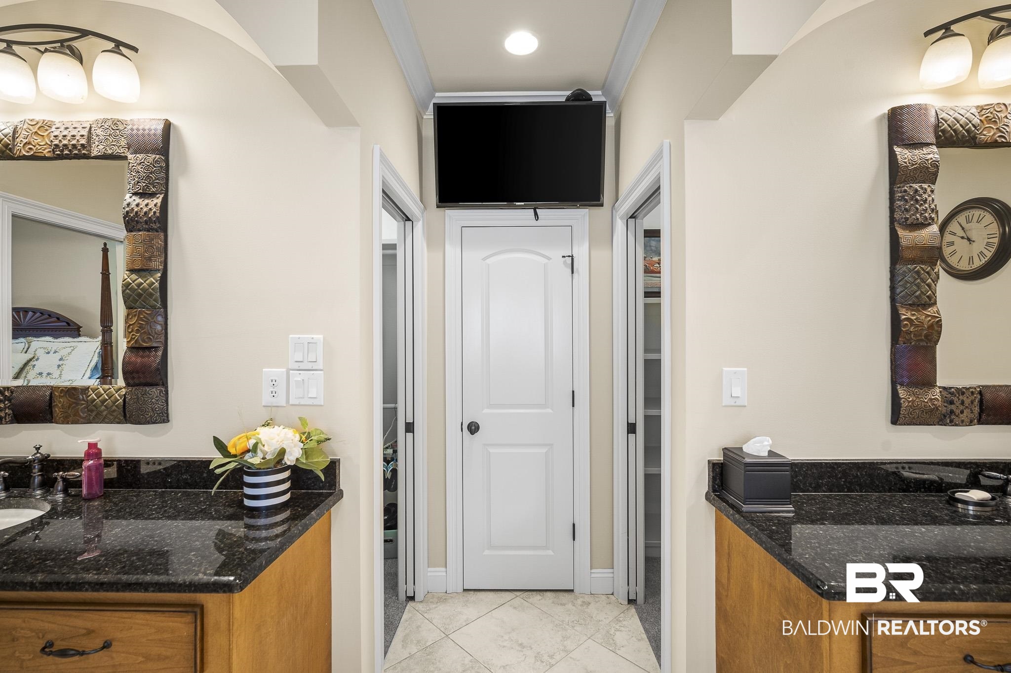 7090 Carson Lane Daphne, AL 36527 - Photo 18 of 37 Kitchen featuring light tile patterned flooring, ornamental molding, and dark stone counters
