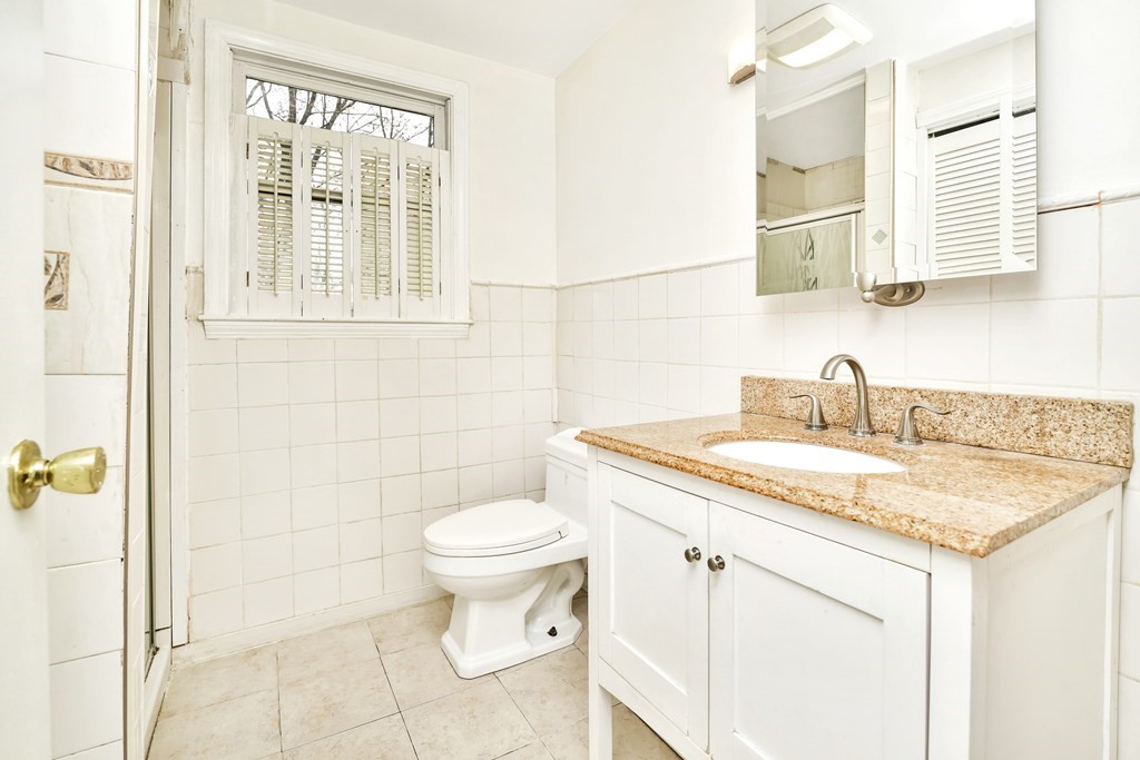 15 Old Farm Road Randolph, MA 02368 - Photo 13 of 22 a bathroom with a sink toilet and shower