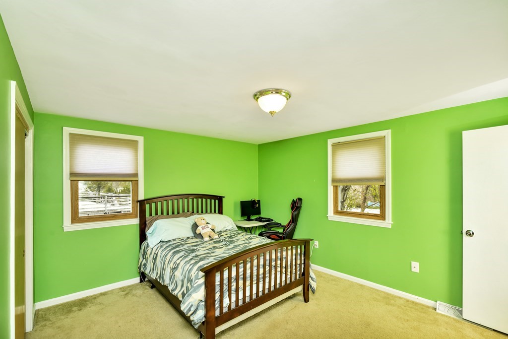 15 Old Farm Road Randolph, MA 02368 - Photo 14 of 22 a bedroom with a bed and a window