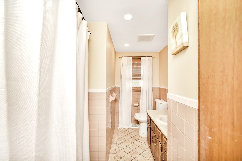 15 Old Farm Road Randolph, MA 02368 - Photo 16 of 22 a bathroom with a sink and a mirror