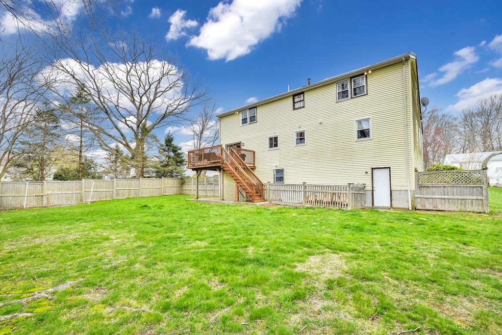 15 Old Farm Road Randolph, MA 02368 - Photo 19 of 22 a view of a back yard of the house with a big yard