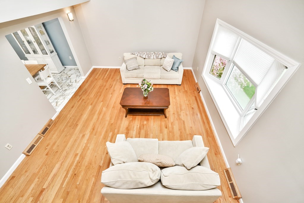 15 Old Farm Road Randolph, MA 02368 - Photo 8 of 22 a living room with furniture and a wooden floor