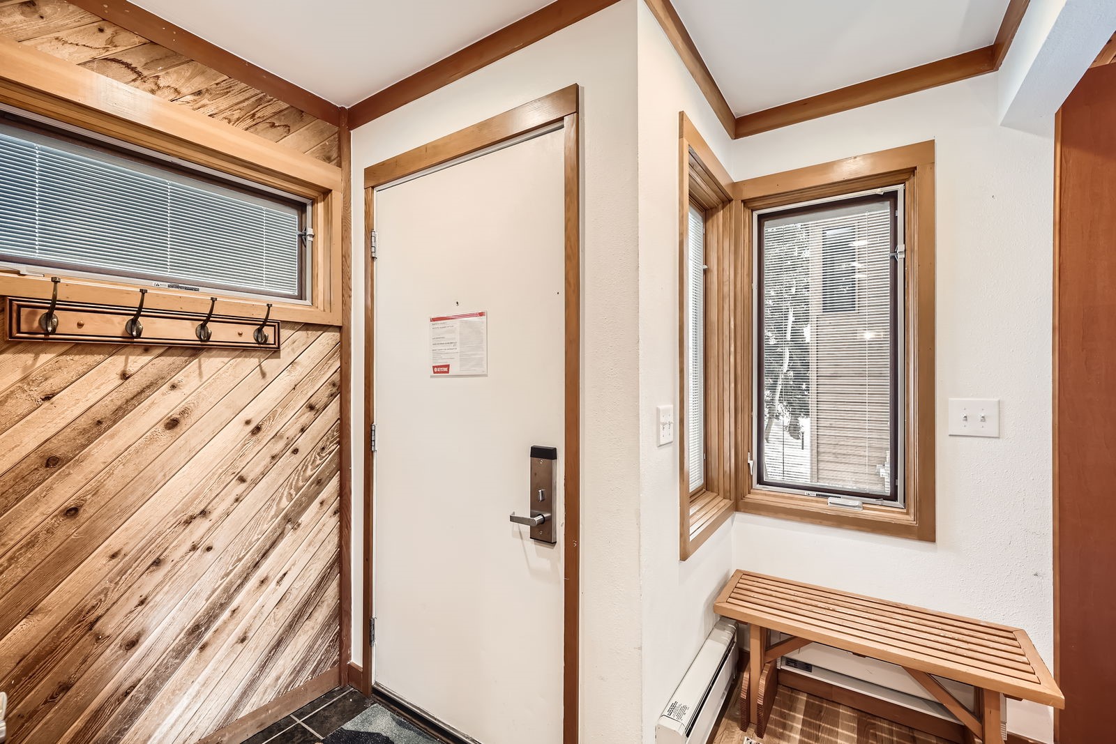 440 Tennis Club Road, Unit 1321 Keystone, CO 80435 - Photo 22 of 42 Entryway featuring ornamental molding, baseboard heating, and wooden walls