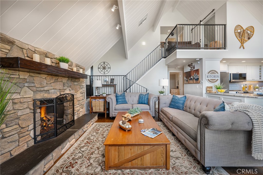 27550 North Bay Road Lake Arrowhead, CA 92352 - Photo 15 of 53 a living room with furniture and a fireplace