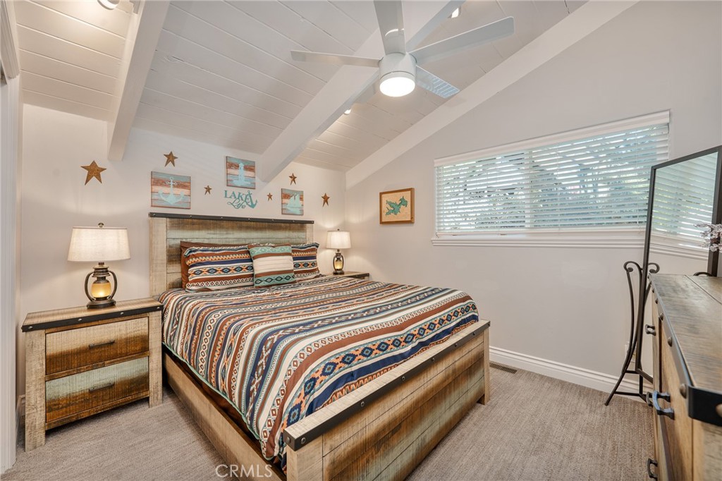 27550 North Bay Road Lake Arrowhead, CA 92352 - Photo 28 of 53 a bedroom with a bed and a window