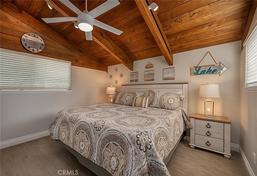 27550 North Bay Road Lake Arrowhead, CA 92352 - Photo 32 of 53 a bedroom with a bed a dresser and a window