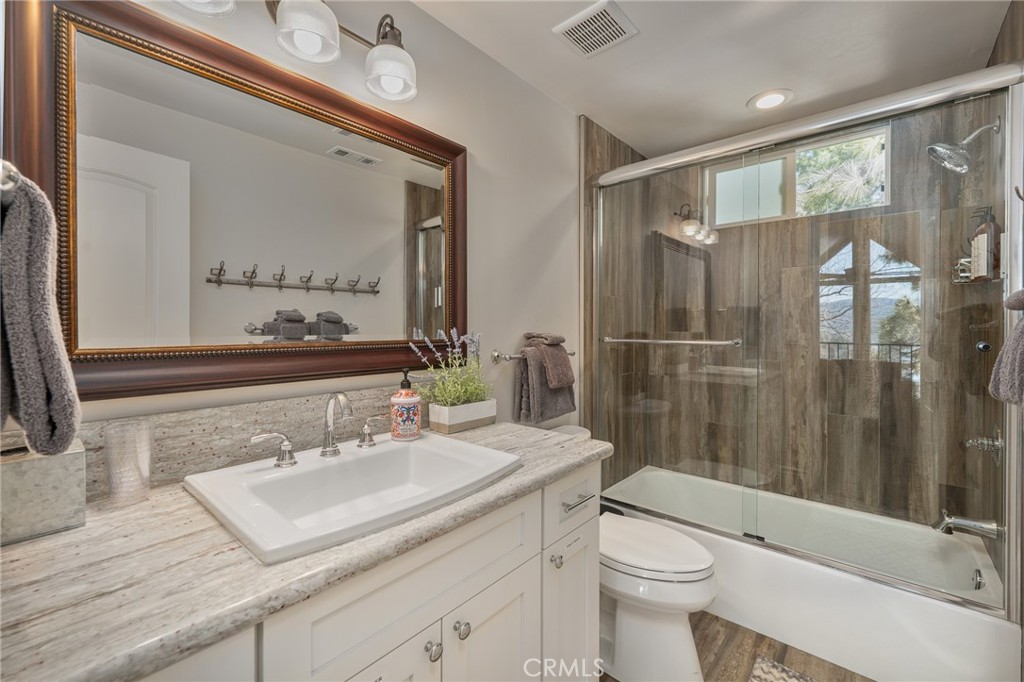 27550 North Bay Road Lake Arrowhead, CA 92352 - Photo 34 of 53 a bathroom with a sink toilet and shower