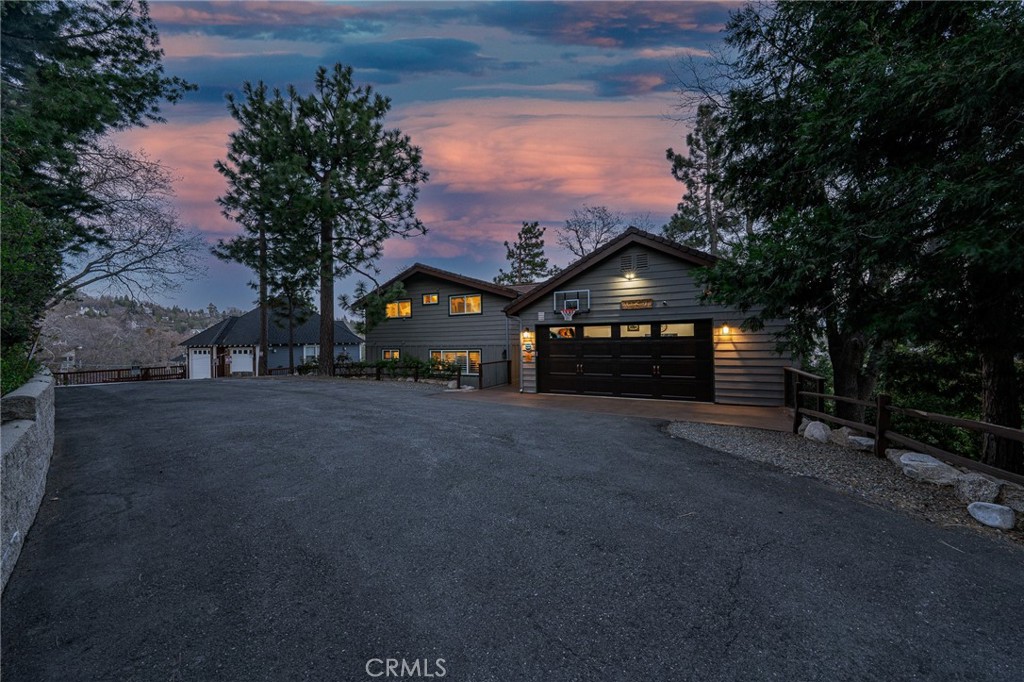 27550 North Bay Road Lake Arrowhead, CA 92352 - Photo 47 of 53 a front view of a house with a yard and garage