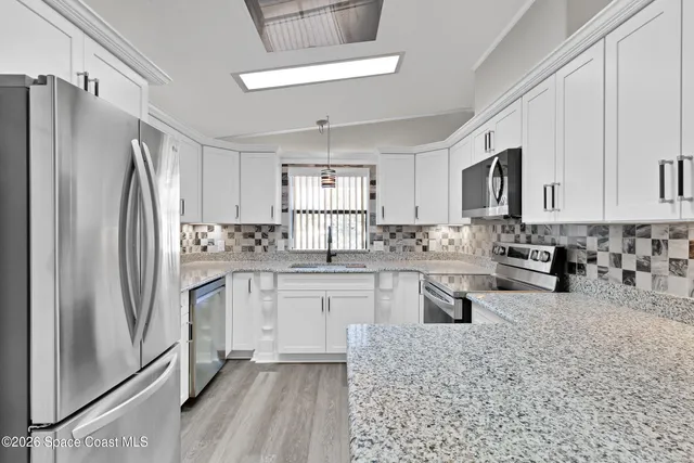 a kitchen with a stove and a microwave