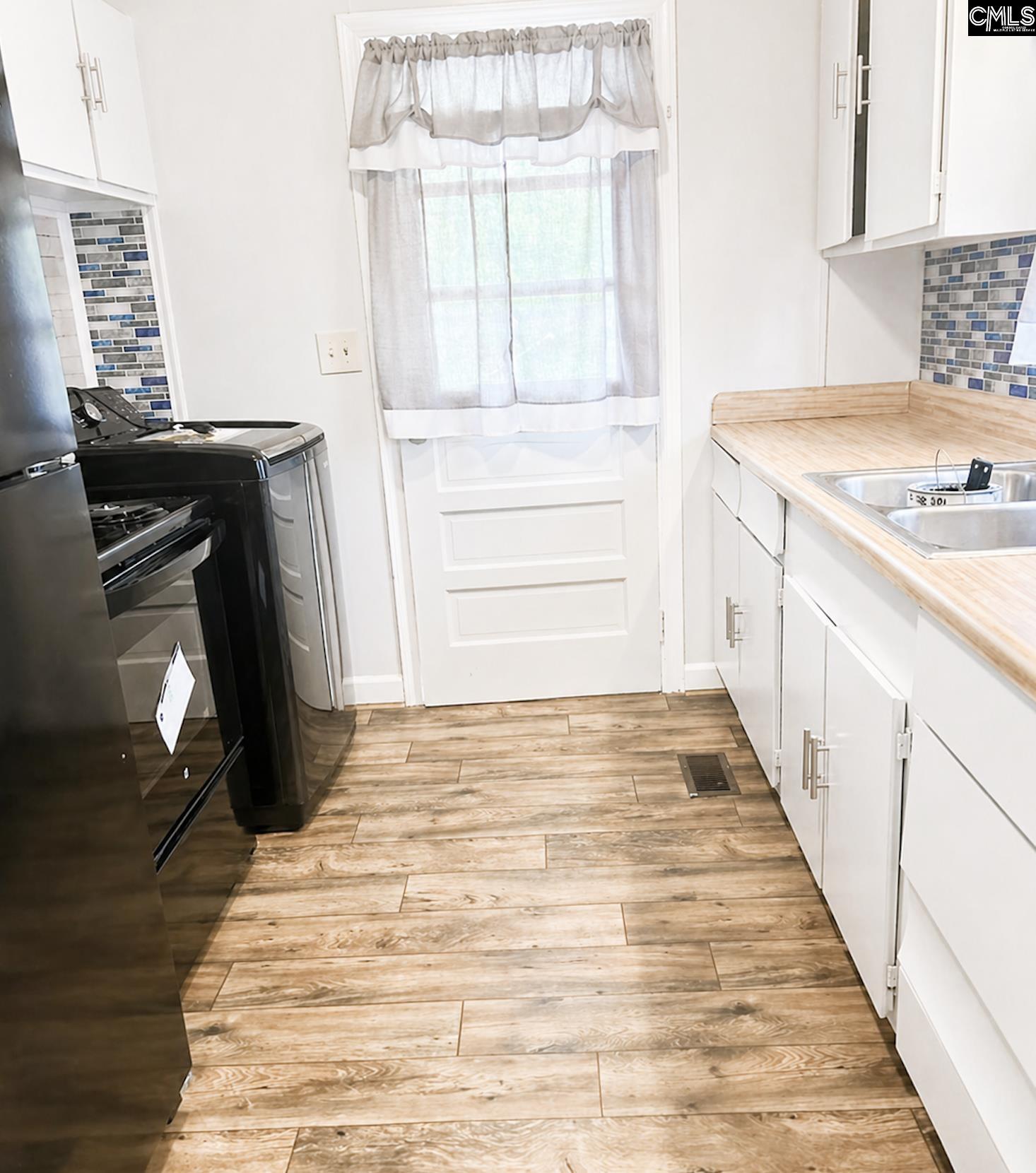 118 State Rd S-38-1224 Cordova, SC 29039 - Photo 5 of 12 a bathroom with a sink and a mirror