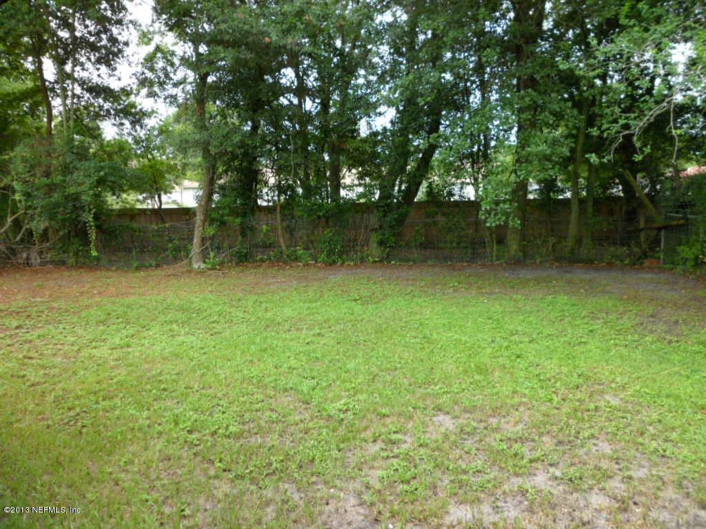 7356 Strato Road Jacksonville, FL 32210 - Photo 3 of 19 a view of outdoor space with deck and yard