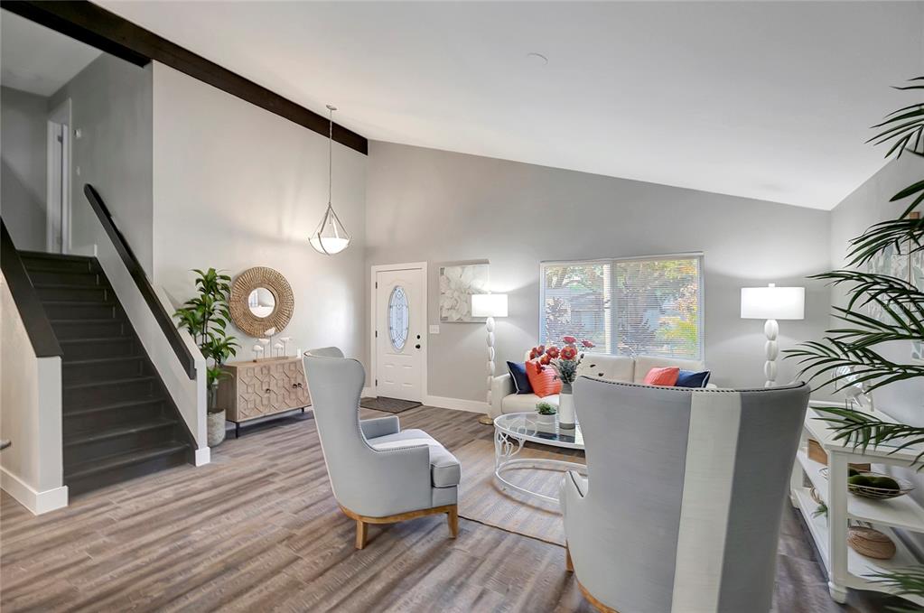 16133 Ravendale Drive Tampa, FL 33618 - Photo 11 of 46 a living room with furniture and a wooden floor
