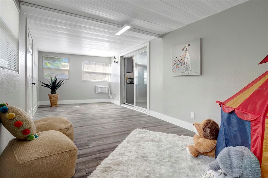 16133 Ravendale Drive Tampa, FL 33618 - Photo 22 of 46 a bedroom with furniture and a wooden floor