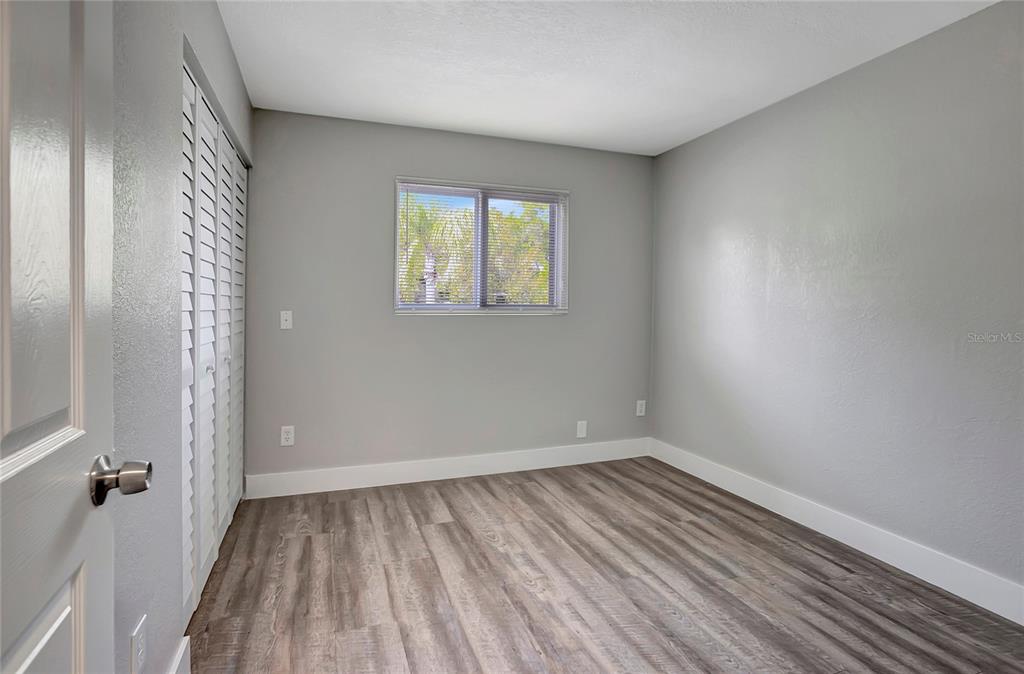 16133 Ravendale Drive Tampa, FL 33618 - Photo 30 of 46 wooden floor in an empty room with a window