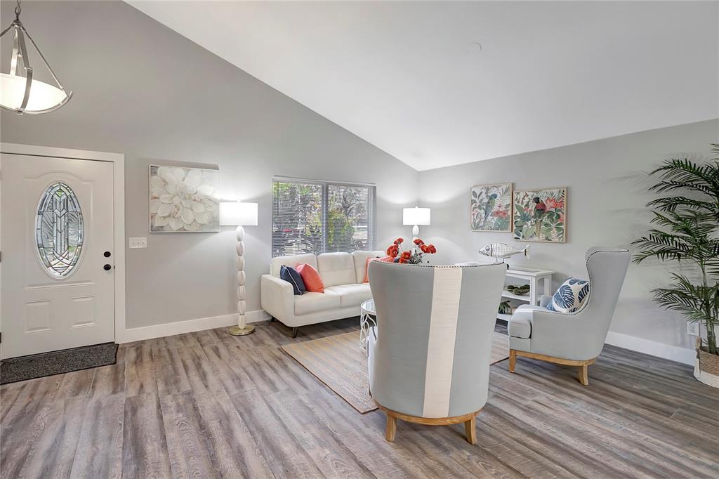 16133 Ravendale Drive Tampa, FL 33618 - Photo 3 of 46 a living room with furniture and wooden floor