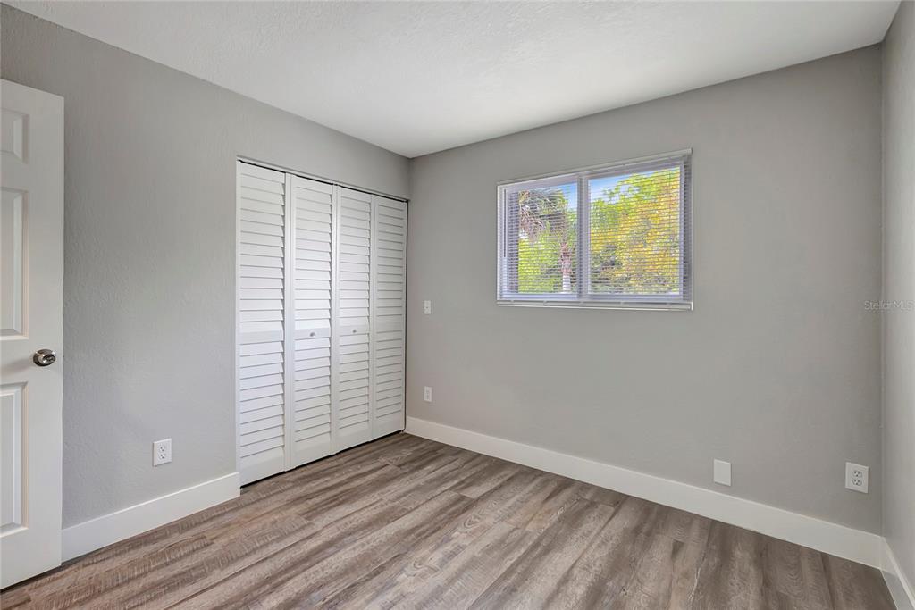 16133 Ravendale Drive Tampa, FL 33618 - Photo 31 of 46 an empty room with windows