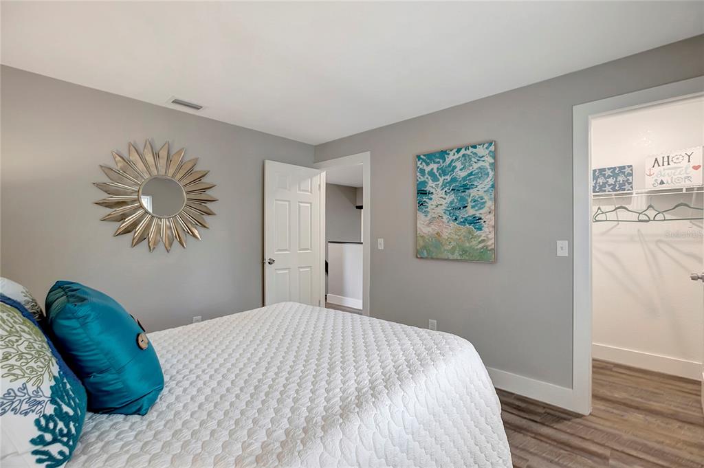 16133 Ravendale Drive Tampa, FL 33618 - Photo 34 of 46 a bedroom with a bed and a painting on the wall