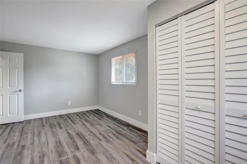 16133 Ravendale Drive Tampa, FL 33618 - Photo 38 of 46 a view of a room with wooden floor and window